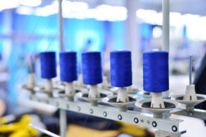 Spools of thread in the sewing equipment. The concept of sewing production.