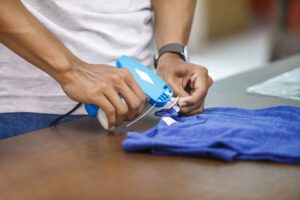 close up portrait of worker at clothing company labelling their product